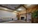 Cozy community room with a fireplace, bookshelves, and comfortable seating at 2611 Pine Lake Ter # B, Sarasota, FL 34237