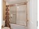 Clean and modern bathroom featuring a shower with a sliding glass door and neutral décor at 4440 Ironwood Cir # 108D, Bradenton, FL 34209