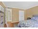 Bedroom featuring wood floors, closet space, and serene lighting at 4440 Ironwood Cir # 108D, Bradenton, FL 34209