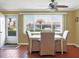 Dining space with wood floors, comfortable seating, and a view of the outdoors at 4440 Ironwood Cir # 108D, Bradenton, FL 34209