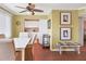 Well-lit dining area with kitchen view, ceiling fan, and stylish decor at 4440 Ironwood Cir # 108D, Bradenton, FL 34209