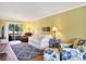 Comfortable living room boasts wood floors, neutral colors, and ample natural light at 4440 Ironwood Cir # 108D, Bradenton, FL 34209
