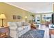 Inviting living room with stylish furniture, wood flooring, and a welcoming atmosphere at 4440 Ironwood Cir # 108D, Bradenton, FL 34209