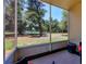 Screened patio with views of well-maintained landscaping and lush greenery, perfect for outdoor relaxation at 4440 Ironwood Cir # 108D, Bradenton, FL 34209