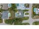 An aerial view of the property featuring a pool and proximity to other residences at 701 Armada S Rd, Venice, FL 34285