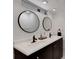 This bathroom showcases a modern vanity with double sinks and stylish fixtures at 701 Armada S Rd, Venice, FL 34285
