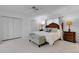 Spacious bedroom features two closets and a comfortable bed, creating a peaceful retreat at 701 Armada S Rd, Venice, FL 34285
