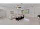 Bright living room features a large window and comfortable, neutral furniture at 701 Armada S Rd, Venice, FL 34285