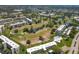 Aerial view of community featuring a golf course and residential buildings at 4440 Ironwood Cir # 108D, Bradenton, FL 34209