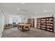 Relaxing community room with a pool table and bookcases at 4440 Ironwood Cir # 108D, Bradenton, FL 34209