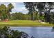 Golf course view with scenic pond at 4440 Ironwood Cir # 108D, Bradenton, FL 34209