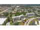Aerial view highlighting a condo building in a lush green neighborhood at 4440 Ironwood Cir # 108D, Bradenton, FL 34209