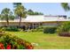 Exterior view of community building with landscaping at 4440 Ironwood Cir # 108D, Bradenton, FL 34209