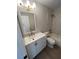 Updated bathroom with white vanity, marble tile, and bathtub at 2611 Pine Lake Ter # B, Sarasota, FL 34237