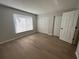 Spacious bedroom with ample closet space and wood-look floors at 2611 Pine Lake Ter # B, Sarasota, FL 34237