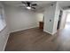 Bright dining area with wood-look flooring and kitchen bar at 2611 Pine Lake Ter # B, Sarasota, FL 34237