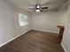 Bright dining area with wood-look flooring and kitchen bar at 2611 Pine Lake Ter # B, Sarasota, FL 34237