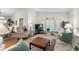 Bright living room with comfortable seating and a large TV at 4560 Forest Wood Trl # 16, Sarasota, FL 34241