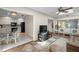 Bright living room with leather furniture, skylights, and view to kitchen at 4560 Forest Wood Trl # 16, Sarasota, FL 34241