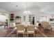 Bright dining area with a glass-top table and seating for six at 4560 Forest Wood Trl # 16, Sarasota, FL 34241