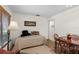 Cozy bedroom with daybed, small table, and window at 4560 Forest Wood Trl # 16, Sarasota, FL 34241