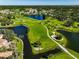 Aerial view of Bent Tree community, showcasing golf course and lake at 4560 Forest Wood Trl # 16, Sarasota, FL 34241