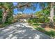 Tan house with a two-car garage and lush landscaping at 4560 Forest Wood Trl # 16, Sarasota, FL 34241
