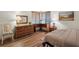 Bedroom with a comfortable bed, dresser, and desk at 4560 Forest Wood Trl # 16, Sarasota, FL 34241