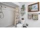 Clean bathroom with shower, toilet, and tiled walls at 4560 Forest Wood Trl # 16, Sarasota, FL 34241