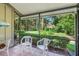 Spacious screened porch overlooking the lush landscape at 4560 Forest Wood Trl # 16, Sarasota, FL 34241
