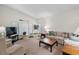 Spacious living area featuring ample natural light and comfy furniture at 4560 Forest Wood Trl # 16, Sarasota, FL 34241