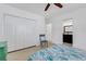 Bedroom with full bed, built-in closet, and access to bathroom at 701 Armada S Rd, Venice, FL 34285