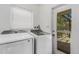 Laundry room with Samsung washer and dryer and exterior access at 701 Armada S Rd, Venice, FL 34285
