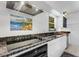 Modern kitchen with stainless steel appliances and granite countertops at 701 Armada S Rd, Venice, FL 34285