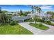 Aerial view of a house with a pool and ocean views at 701 Armada S Rd, Venice, FL 34285