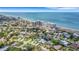 Aerial view of a house with a large backyard near the ocean at 701 Armada S Rd, Venice, FL 34285
