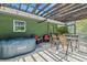 Patio with hot tub, seating, and access to the pool area at 701 Armada S Rd, Venice, FL 34285