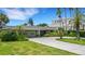 House exterior showcasing a lush green lawn and driveway at 701 Armada S Rd, Venice, FL 34285