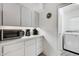 Laundry room with washer, dryer, and extra counter space at 701 Armada S Rd, Venice, FL 34285