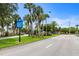 Park-like street view with directional signage for local attractions at 701 Armada S Rd, Venice, FL 34285
