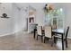 Bright dining room with a modern chandelier and large window at 14719 1St E Ave, Bradenton, FL 34212