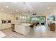 Open concept kitchen with island, stainless steel appliances, and white cabinets at 379 Aruba Cir # 202, Bradenton, FL 34209