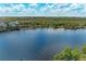 Stunning aerial view of a tranquil lake and surrounding landscape at 379 Aruba Cir # 202, Bradenton, FL 34209