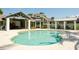 Relaxing resort-style pool with grilling station nearby at 379 Aruba Cir # 202, Bradenton, FL 34209