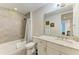 Bathroom with shower/tub combo, granite countertop, and white cabinets at 379 Aruba Cir # 202, Bradenton, FL 34209