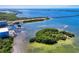 Aerial view of waterfront property with lush island and boat access at 379 Aruba Cir # 202, Bradenton, FL 34209