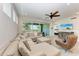 Spacious living room with sectional sofa and access to screened balcony at 379 Aruba Cir # 202, Bradenton, FL 34209