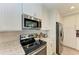 Stainless steel appliances and granite countertops in this kitchen at 379 Aruba Cir # 202, Bradenton, FL 34209