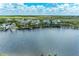 Aerial view of waterfront homes with lush landscaping and a serene lake at 379 Aruba Cir # 202, Bradenton, FL 34209