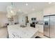 Open kitchen with a large island and stainless steel appliances at 379 Aruba Cir # 202, Bradenton, FL 34209